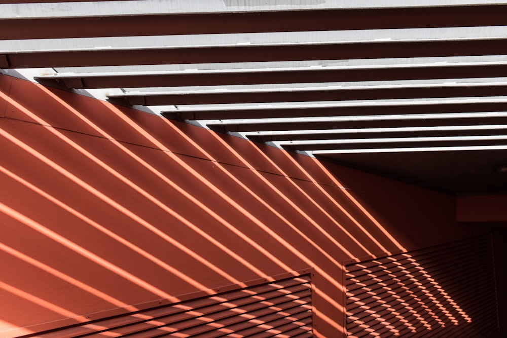 the shadow of a building on a wall