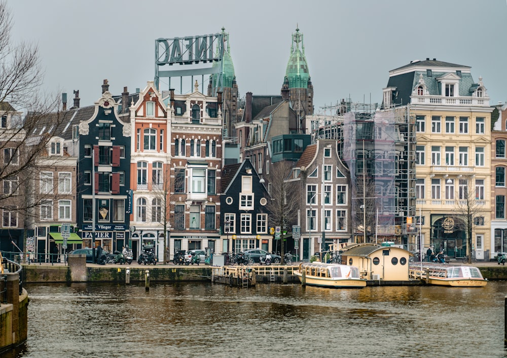 a river with a bunch of buildings in the background