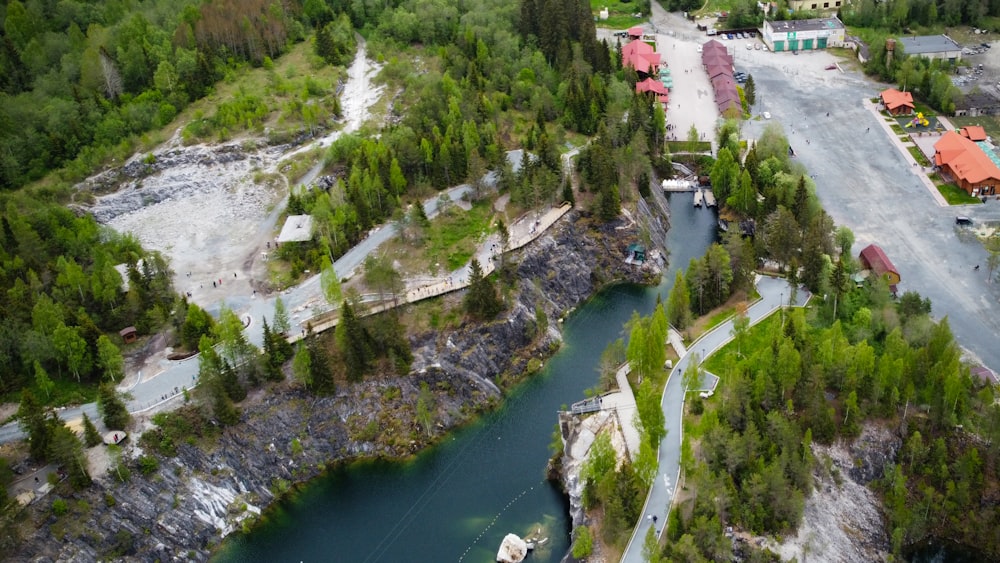 an aerial view of a river running through a town