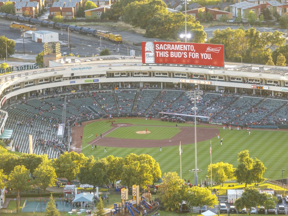 an aerial view of a baseball stadium with a banner
