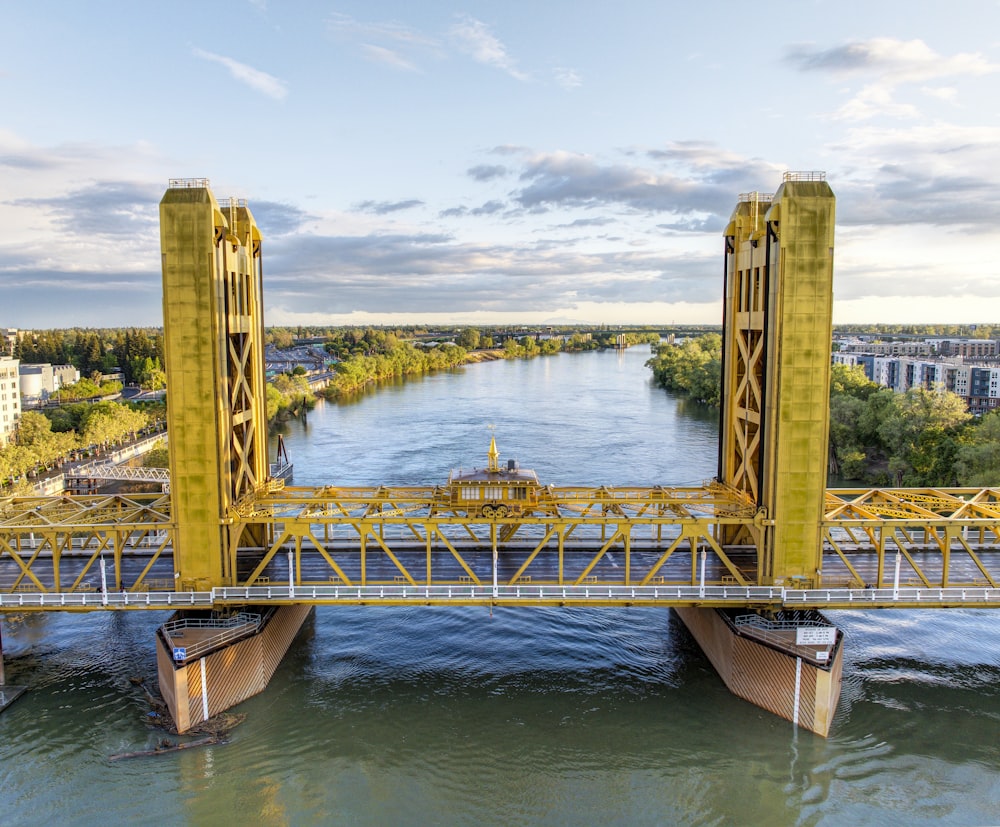 a bridge over a river with a boat on it