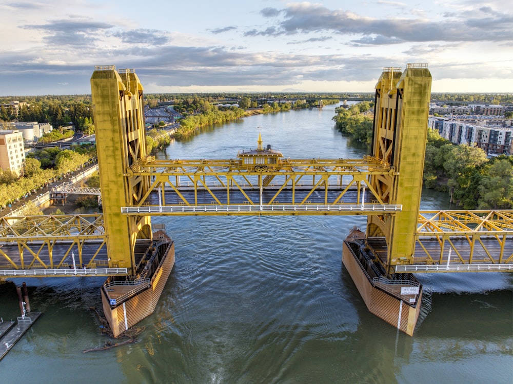 a bridge over a river with two boats in it