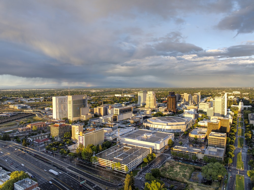 an aerial view of a city with a cloudy sky