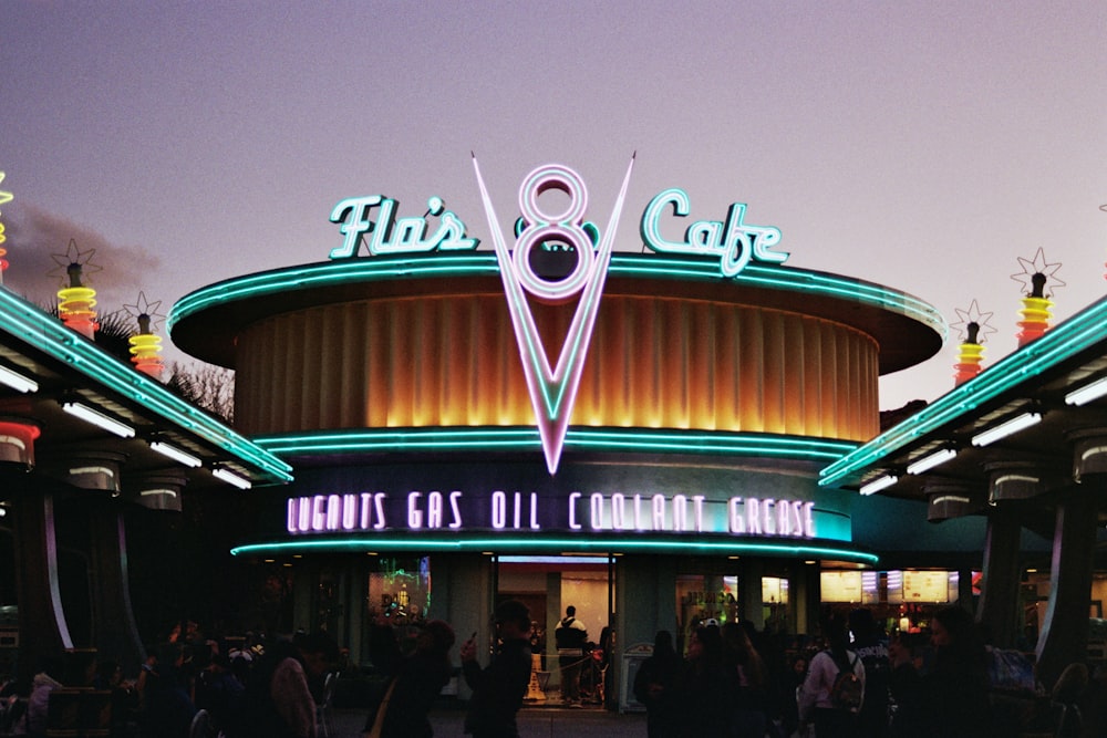 a large building with a neon sign on top of it