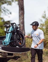 a man standing next to a parked motorcycle