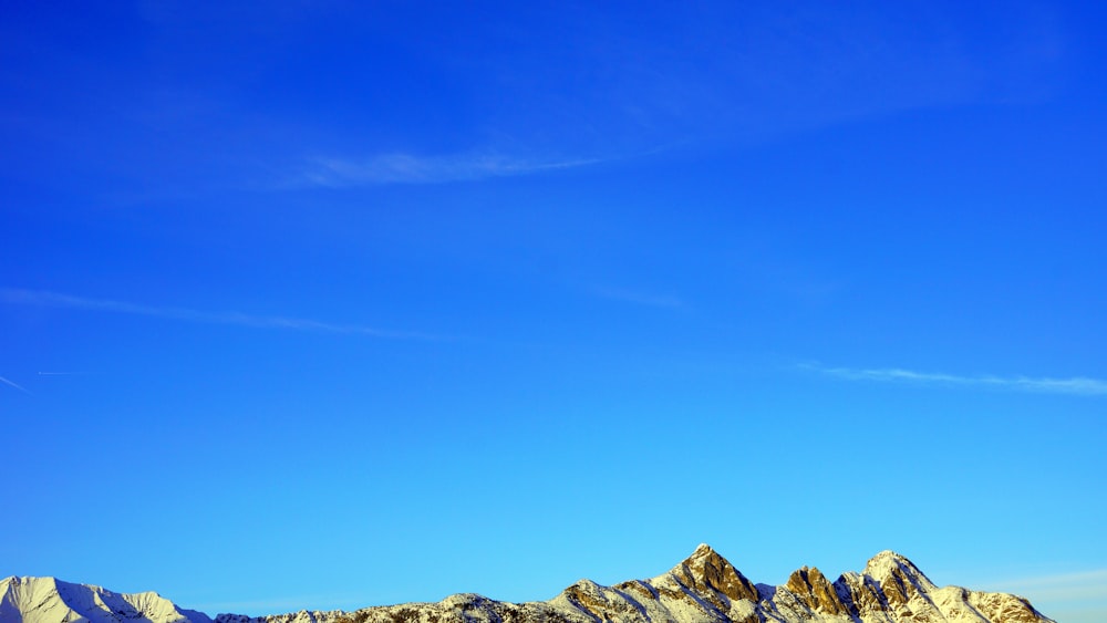 a view of a mountain range with a clear blue sky