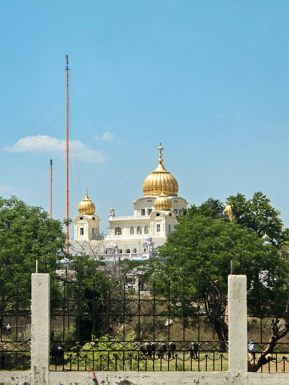 a large white building with a golden dome