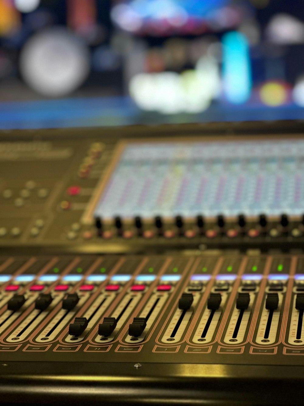 a close up of a sound mixing console