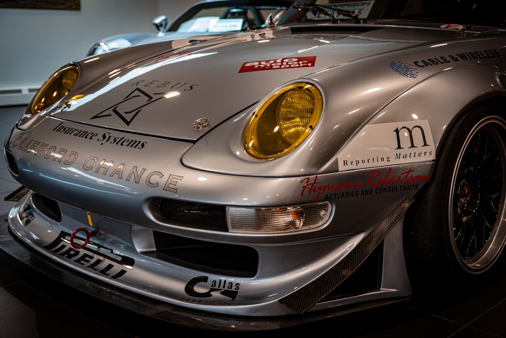 a silver sports car parked in a garage