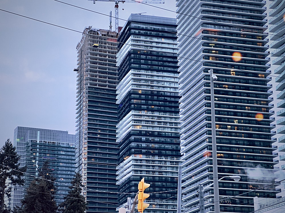 a group of tall buildings next to each other