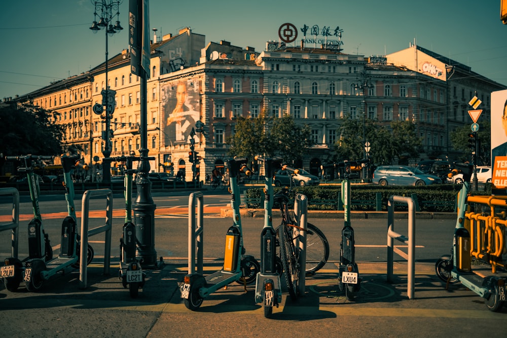 a row of bikes parked next to each other on a street