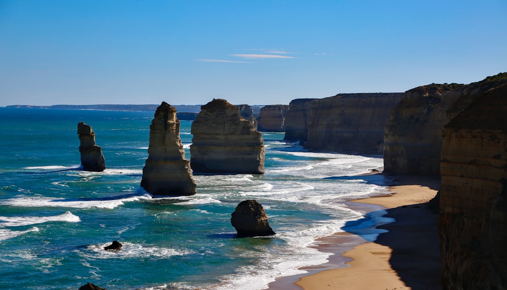 a view of the ocean and cliffs of the great ocean road