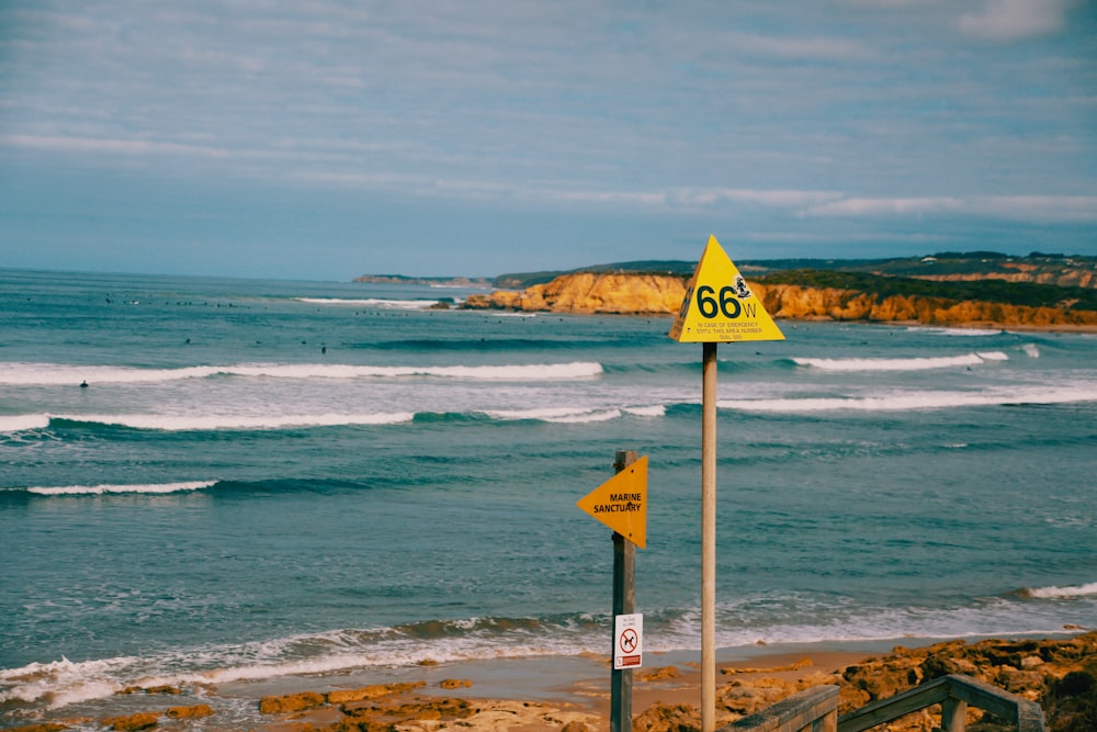 a sign on a beach that says 66