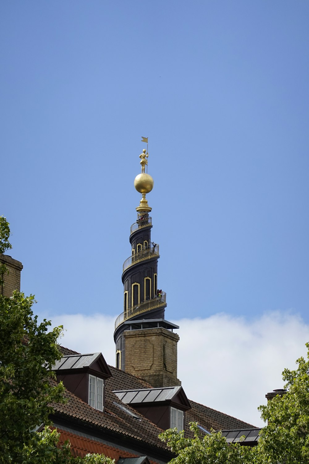 a tall building with a gold dome on top