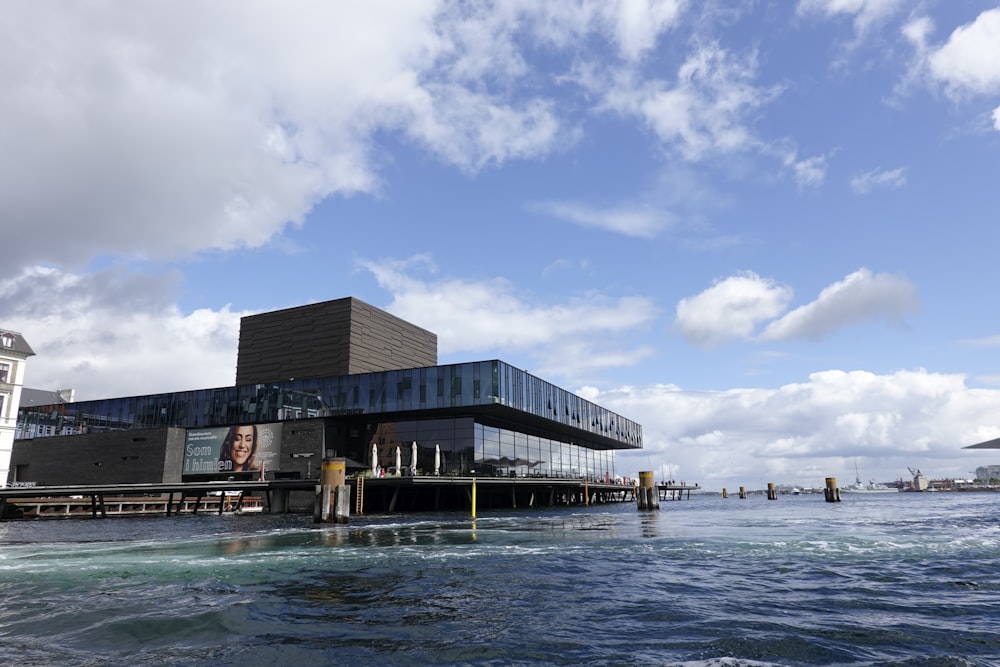 a large building sitting on top of a body of water