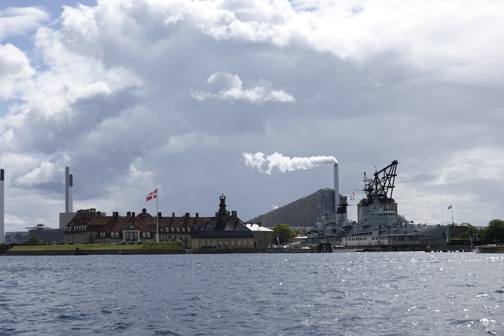 a view of a factory from the water