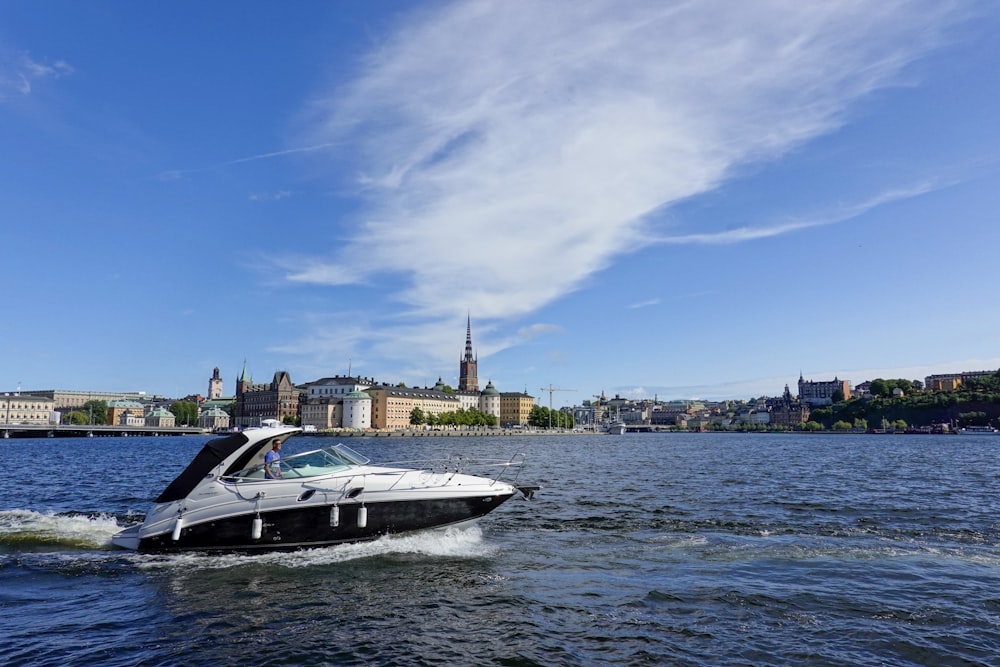 a black and white boat in a body of water