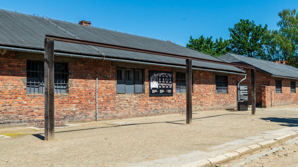 a red brick building with a black roof