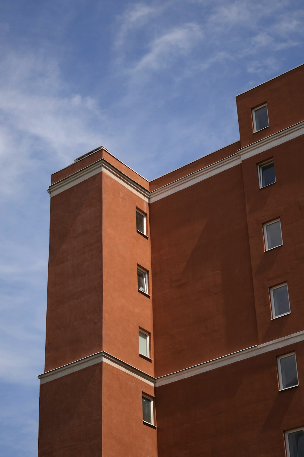 a tall building with a clock on the side of it