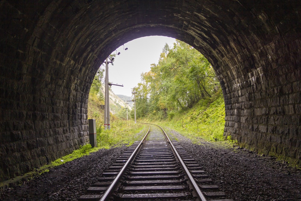 a train track going through a tunnel