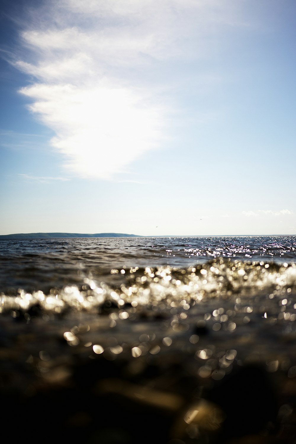 a person riding a surfboard on a body of water