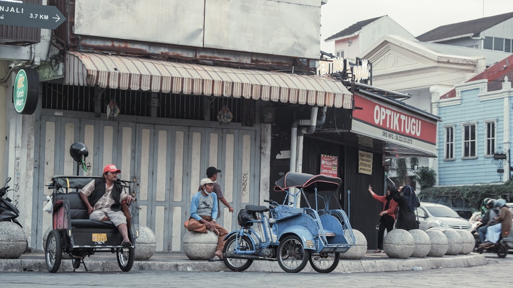 a group of people riding motorcycles down a street