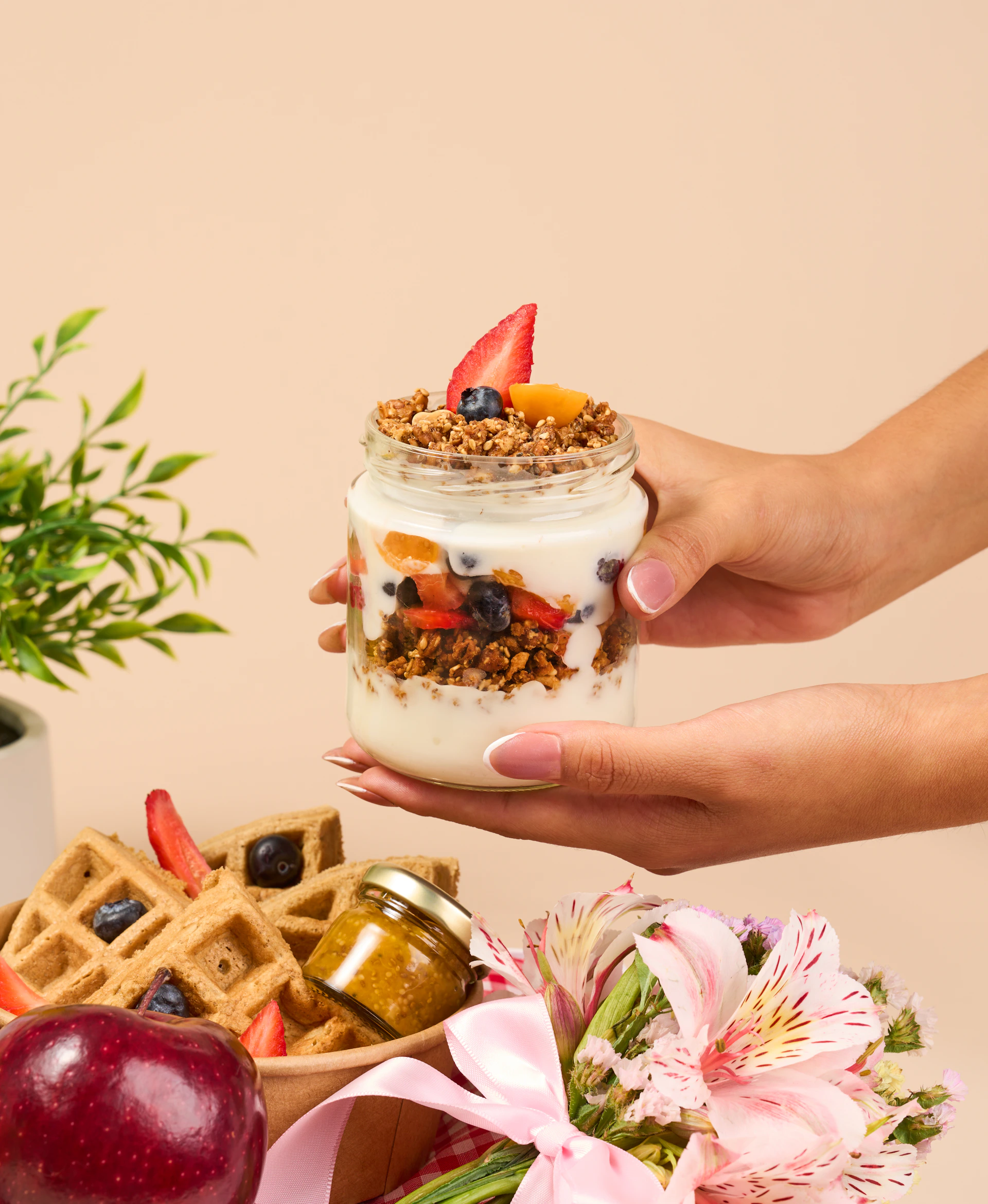 a person is holding a jar of food