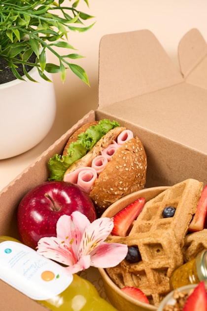 bento snack box for kids with sandwich, waffle bites and fresh fruit compartments