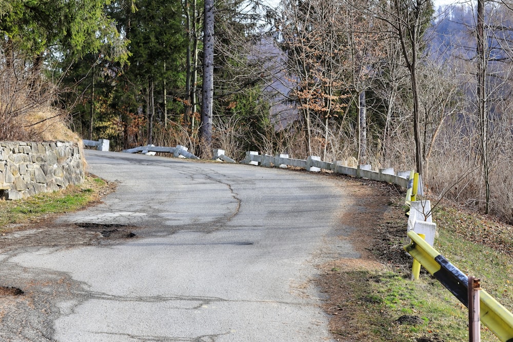 a road with a yellow barricade on the side of it