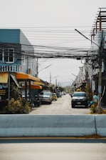 a street with cars parked on the side of it