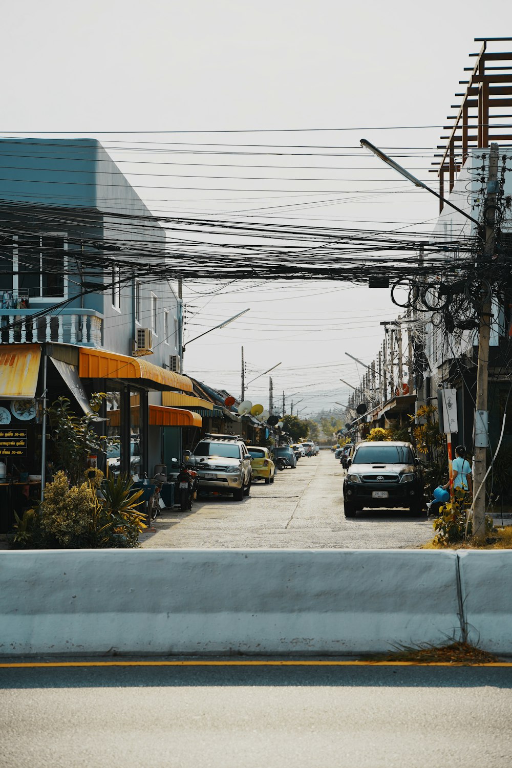 a street with cars parked on the side of it