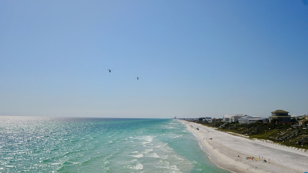 a view of a beach from the top of a hill