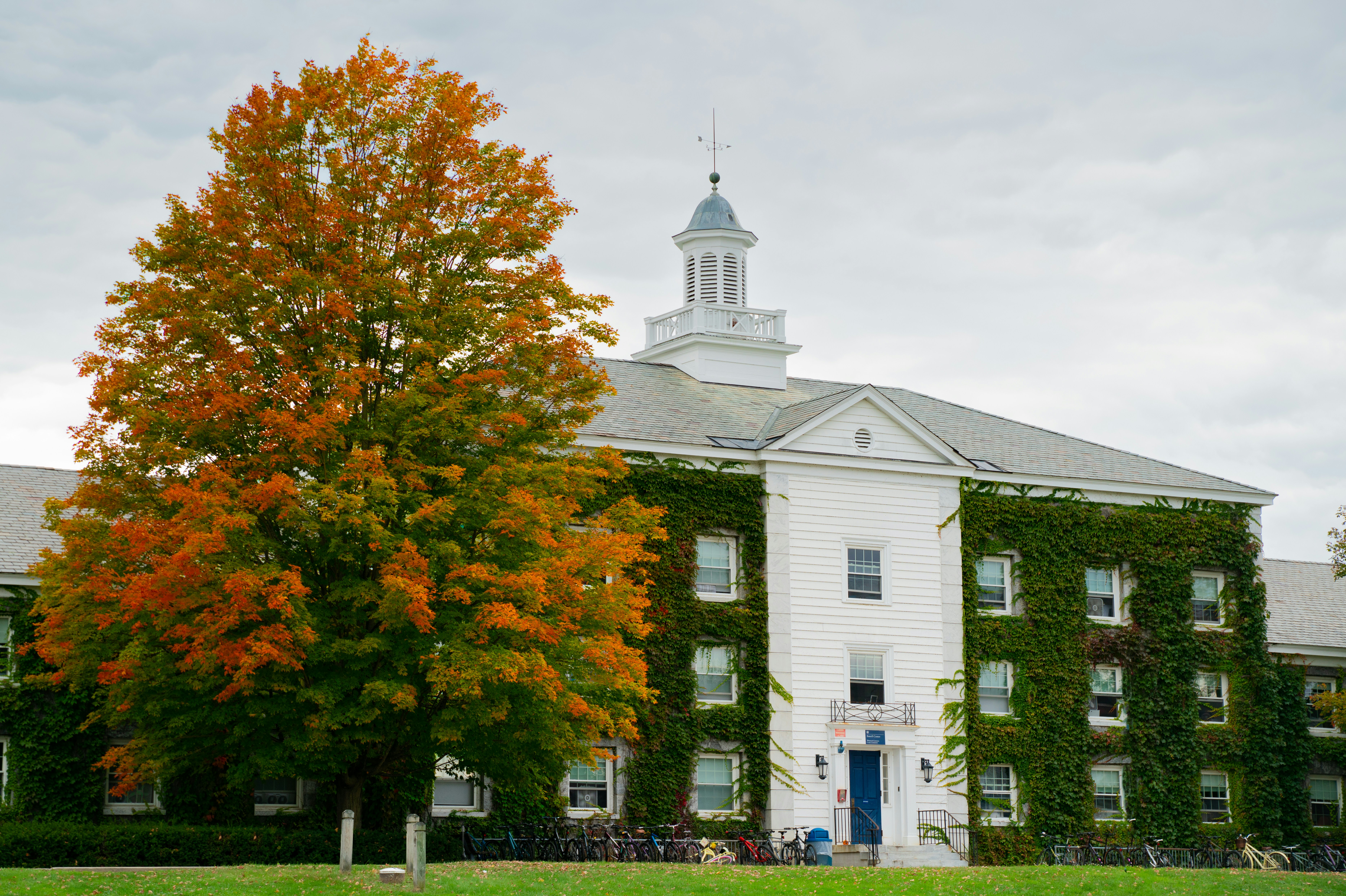 a large white building with a clock tower