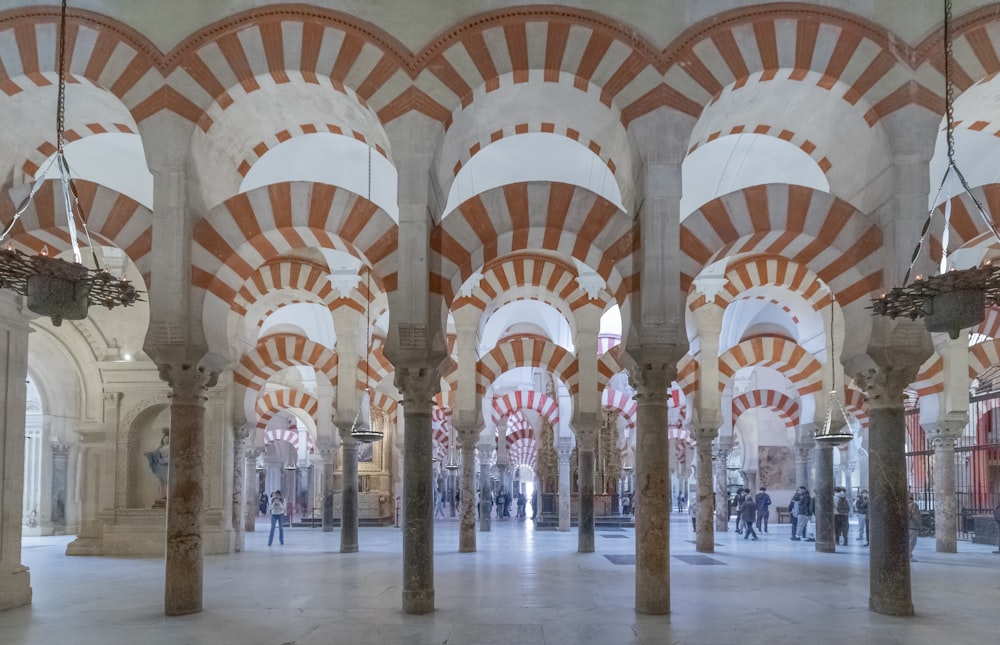 a large room with many arches and pillars