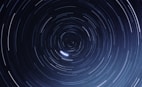 a star trail is seen in the night sky