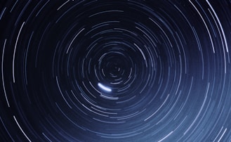 a star trail is seen in the night sky