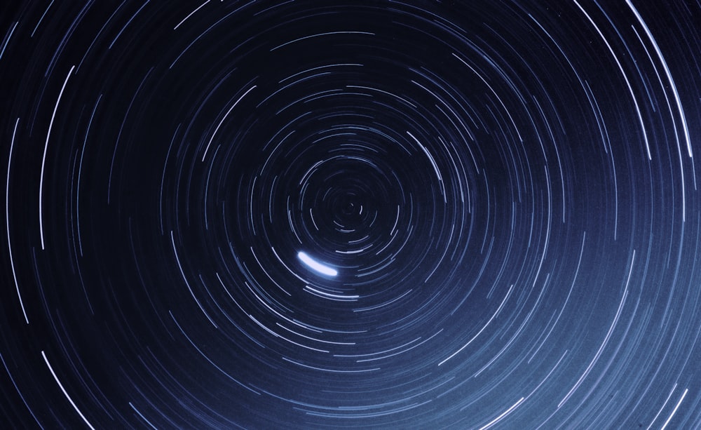 a star trail is seen in the night sky