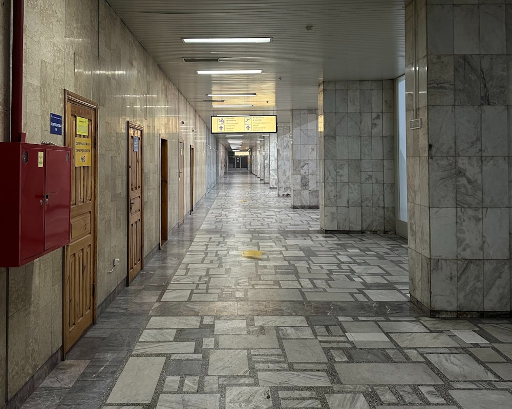 a long hallway with a bunch of doors