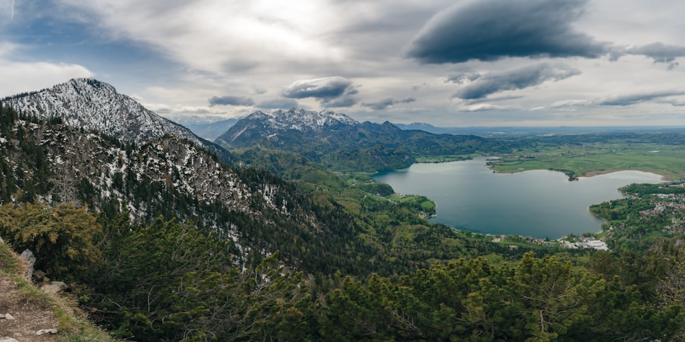 a view of a mountain with a lake in the foreground