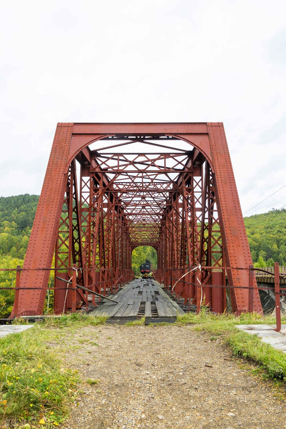 a train traveling across a bridge over a river