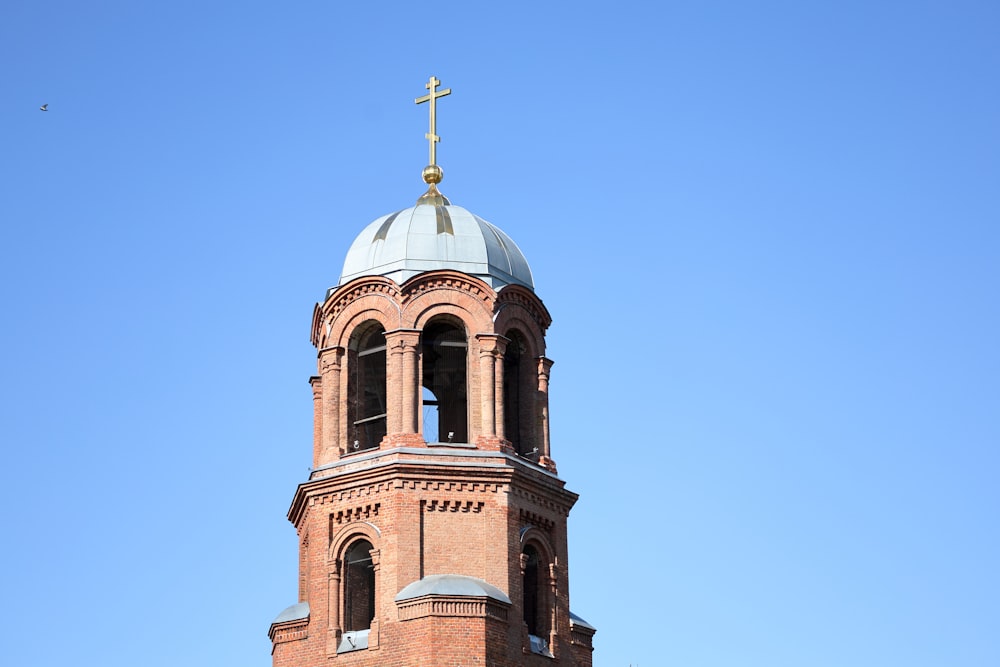 a church steeple with a cross on top