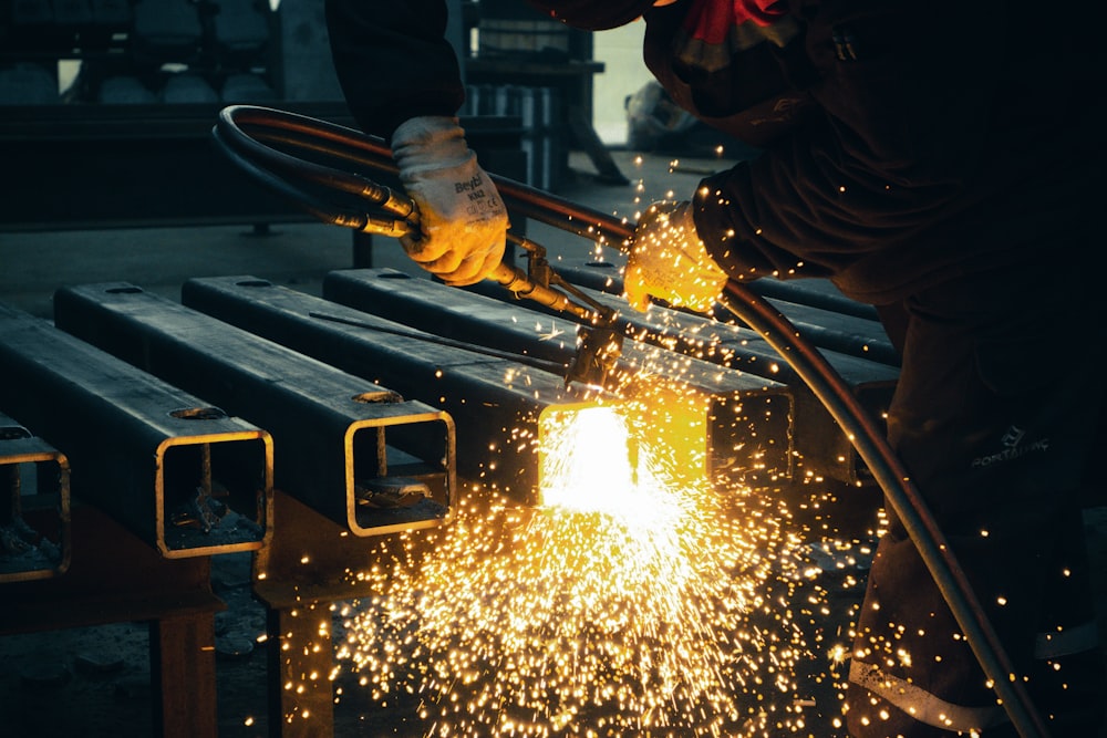 welder working on a piece of metal in a factory