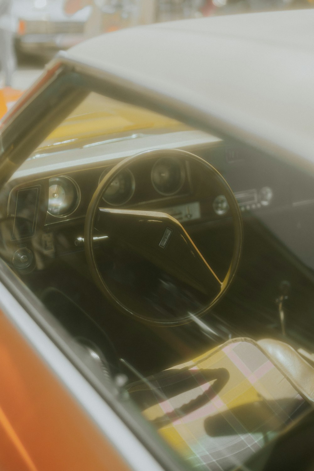 a close up of a steering wheel and dashboard of a car