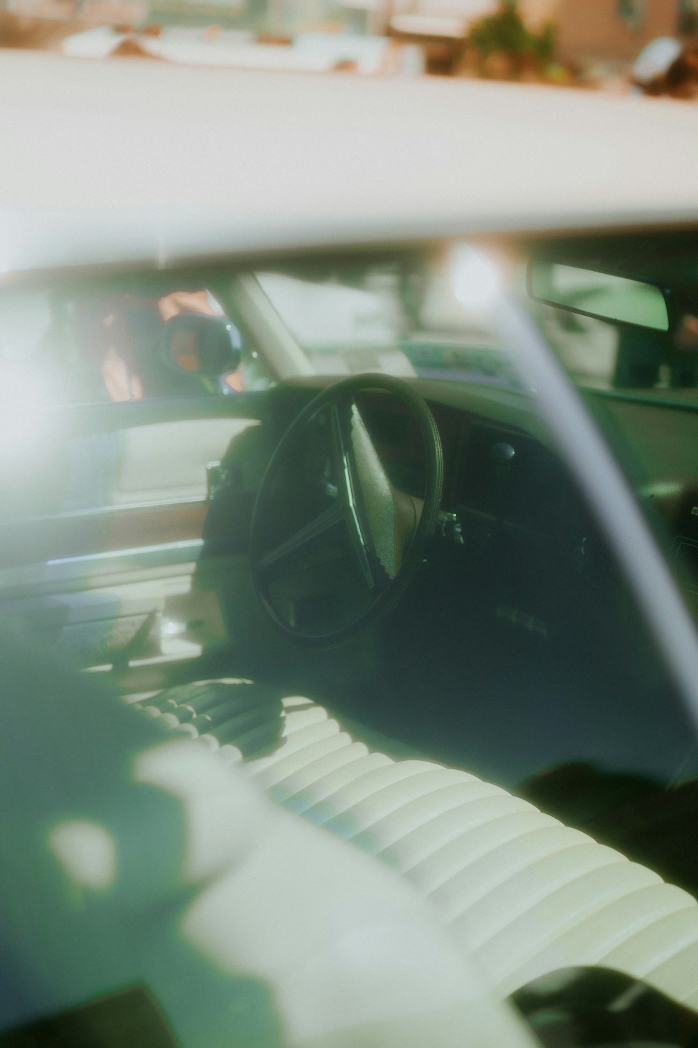 the interior of a car with the sun shining through the windshield