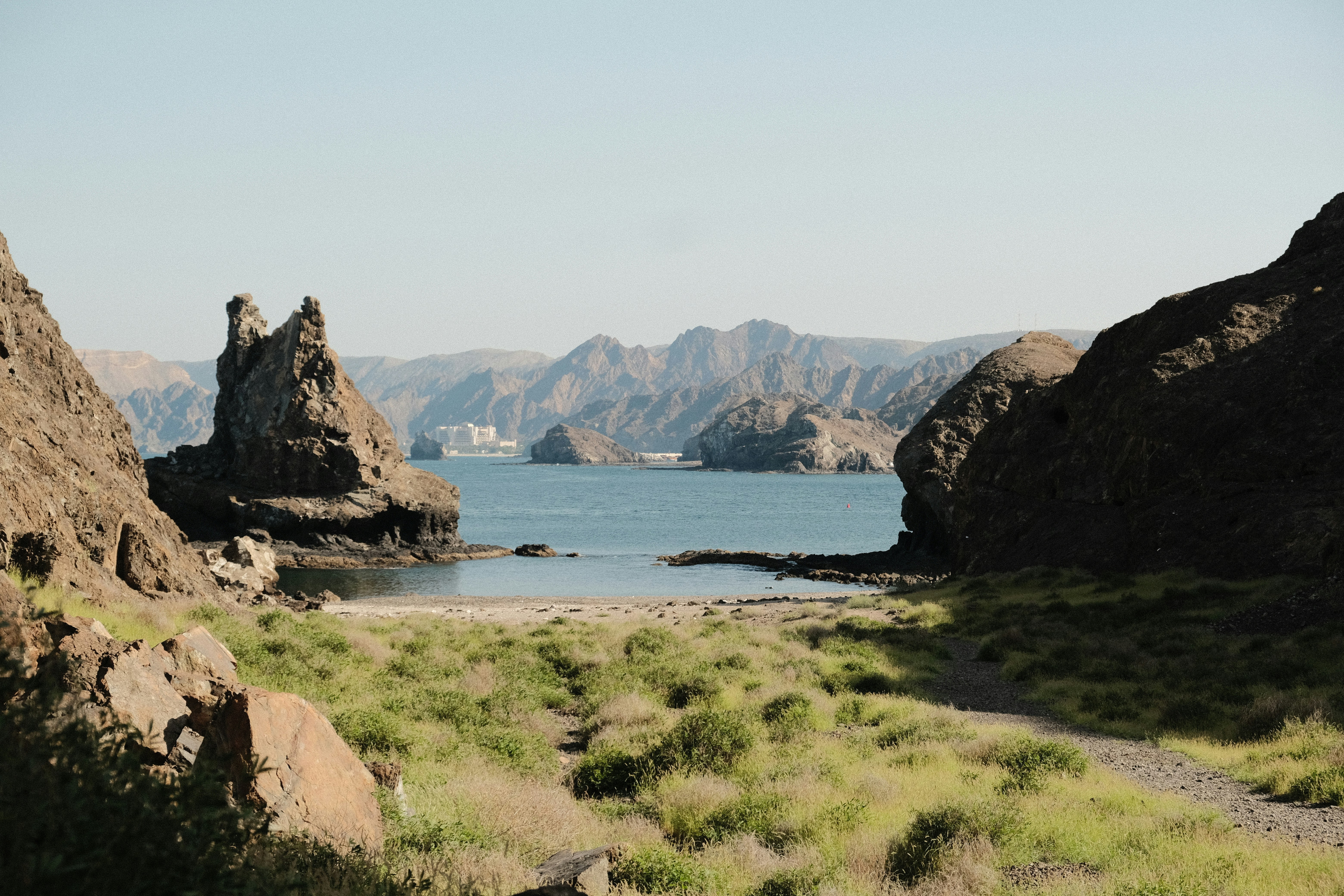a large body of water surrounded by mountains, Cove near Muscat, Oman. March 2024. SOOC JPEG.