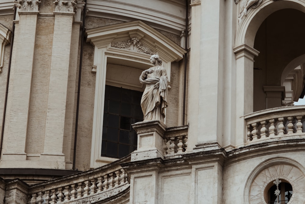 a statue on the side of a building