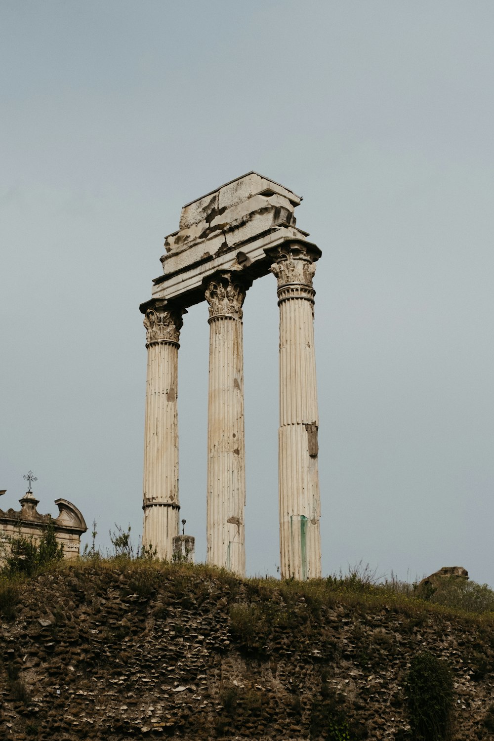 a tall stone structure sitting on top of a hill