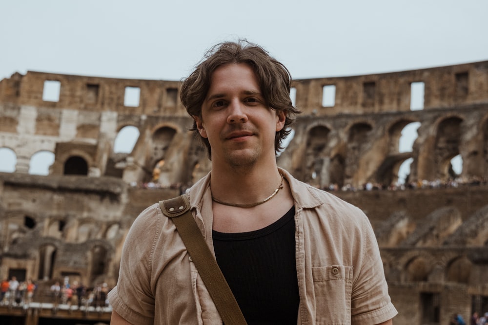 a man standing in front of an old building