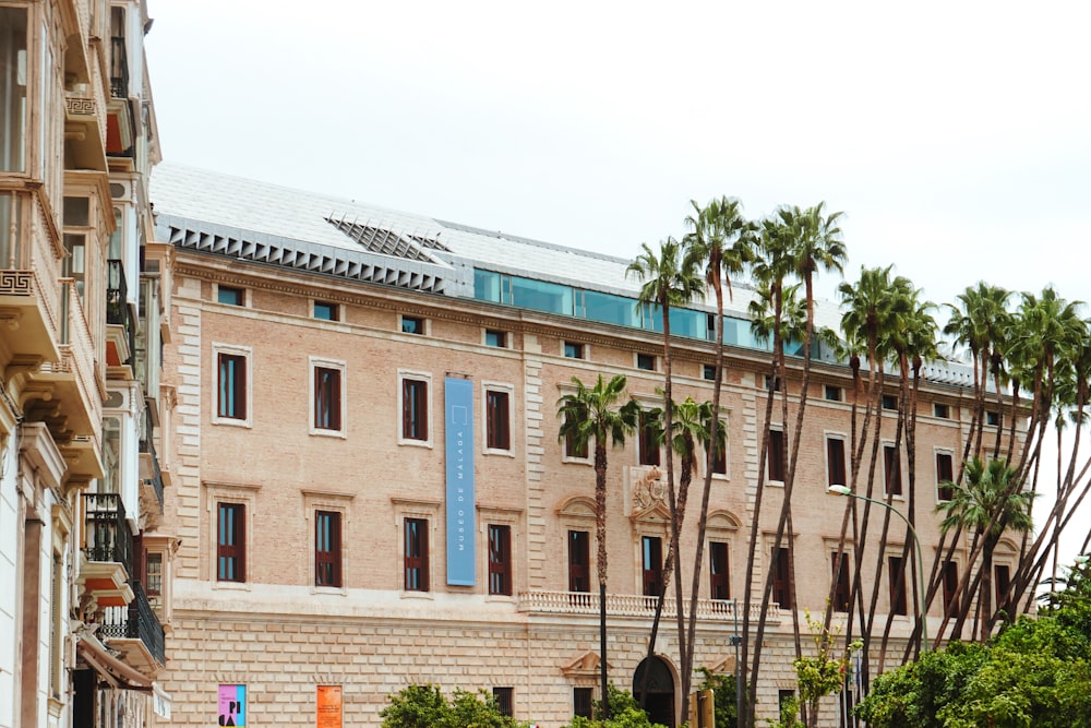 a building with palm trees in front of it