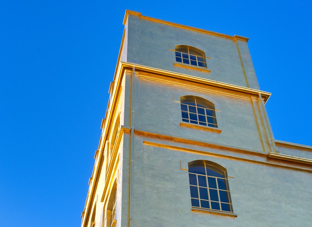 a very tall building with a clock on the side of it